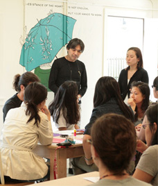 shu photo: man addressing a group of students seated at a table