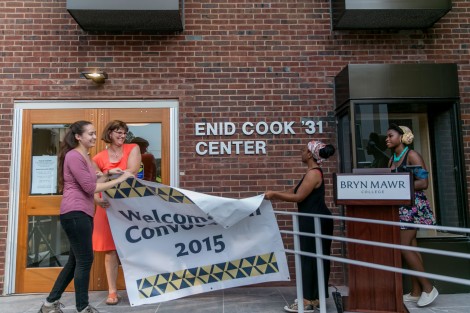 President Cassidy and students Grace Pusey, Khadijah Seay, and Danielle Cadet unveil at the Cook Center dedication.